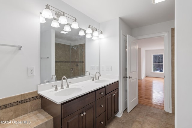 bathroom featuring vanity and an enclosed shower