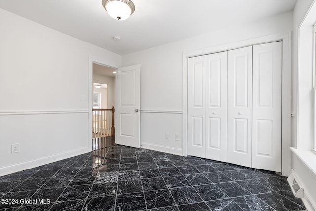 unfurnished bedroom featuring a closet