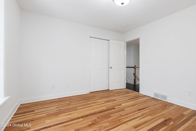 unfurnished room featuring wood-type flooring