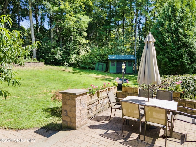 view of patio featuring a storage unit