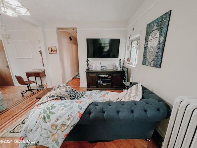 living room with radiator and parquet floors