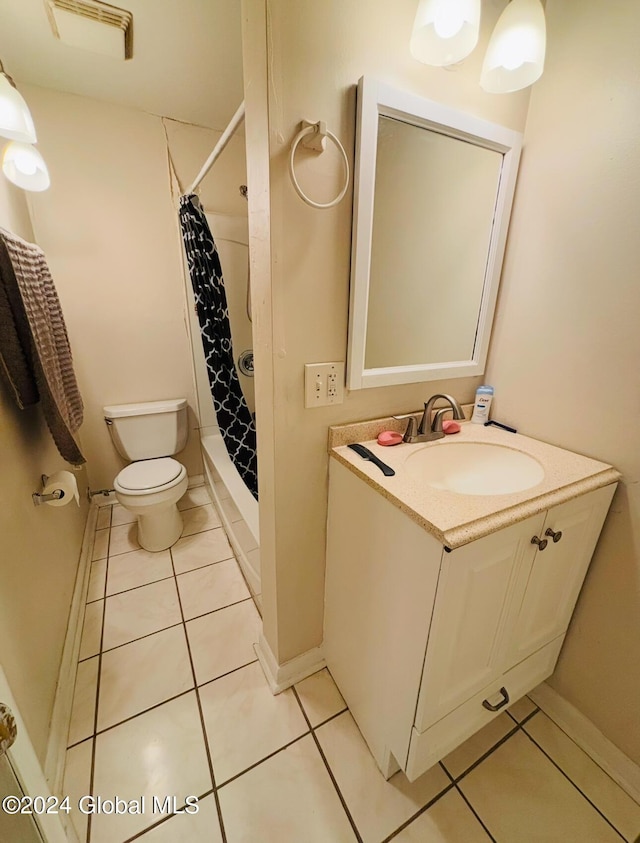 bathroom featuring tile patterned floors, vanity, toilet, and a shower with shower curtain