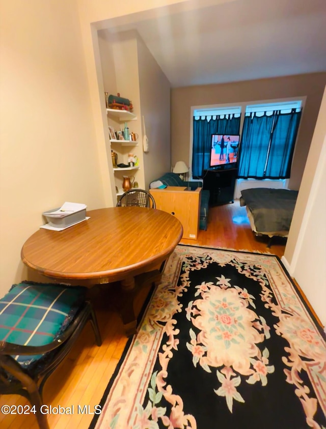 dining area with wood-type flooring