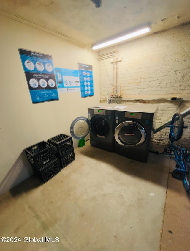 clothes washing area with washer and dryer