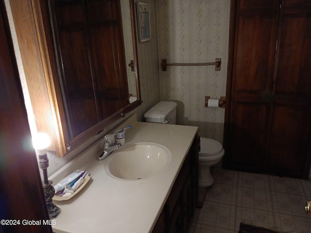 bathroom featuring vanity and toilet