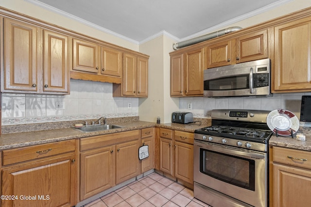 kitchen with decorative backsplash, appliances with stainless steel finishes, crown molding, sink, and light tile patterned flooring