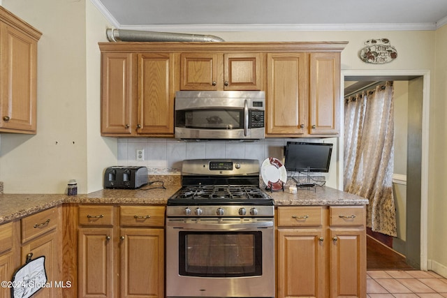 kitchen with backsplash, light stone counters, ornamental molding, stainless steel appliances, and light tile patterned floors