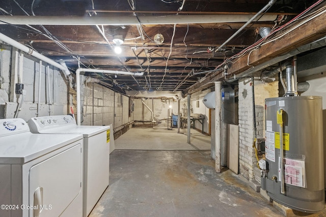 basement featuring separate washer and dryer and water heater