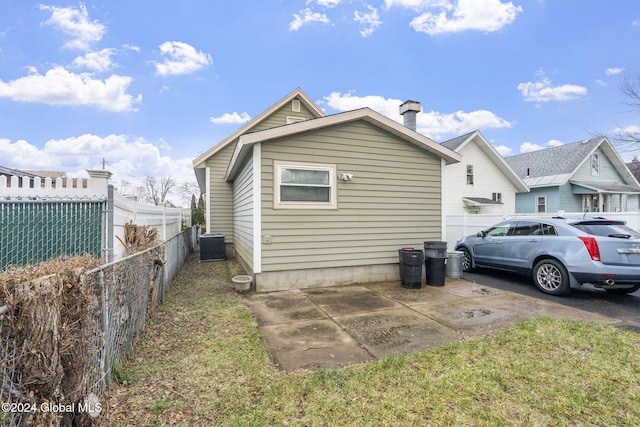 view of side of property featuring central AC unit