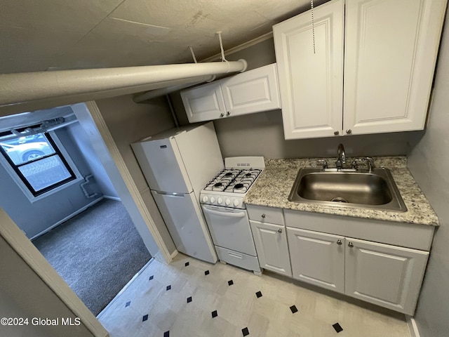 kitchen featuring crown molding, sink, white cabinets, and white appliances