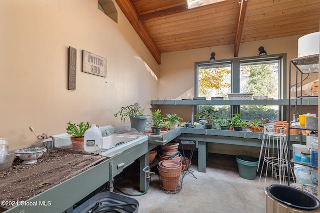 interior space featuring vaulted ceiling with beams, wooden ceiling, and concrete flooring