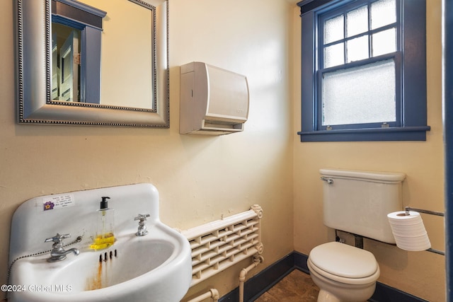 bathroom featuring tile patterned floors, toilet, and sink