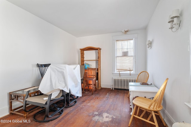 miscellaneous room featuring dark hardwood / wood-style floors and radiator heating unit