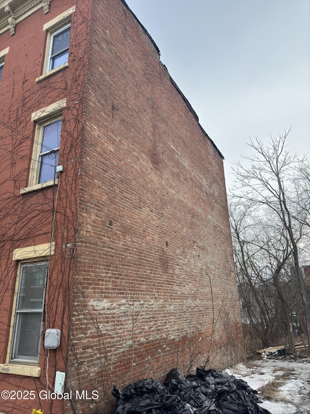 view of home's exterior with brick siding