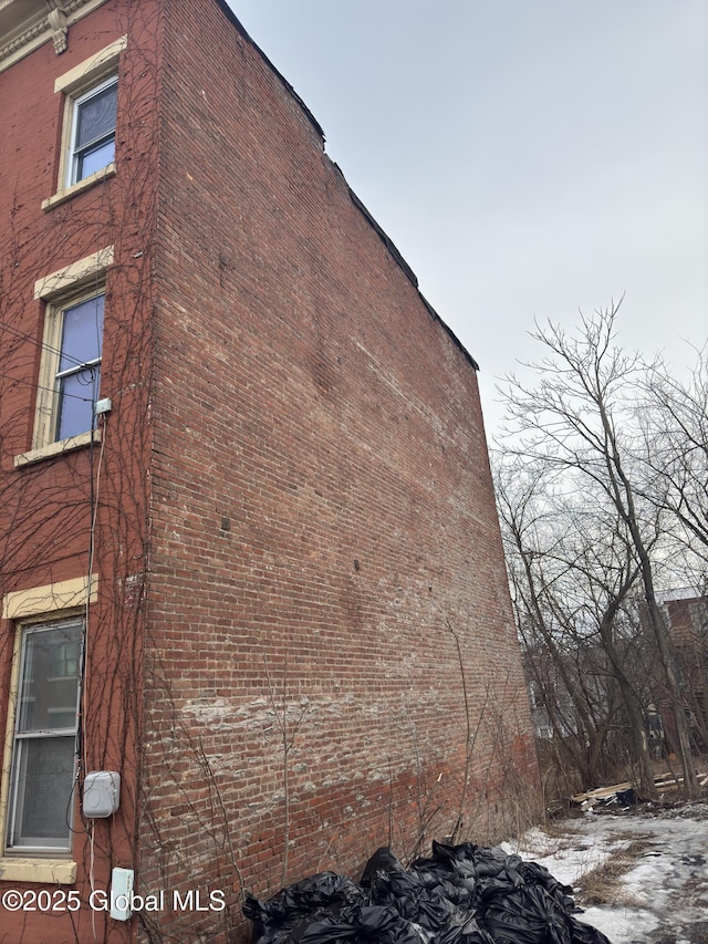 view of home's exterior featuring brick siding