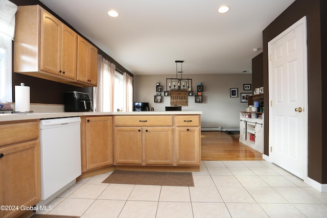 kitchen with white dishwasher, hanging light fixtures, light tile patterned floors, baseboard heating, and kitchen peninsula