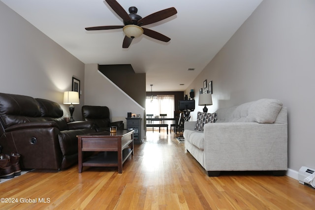 living room featuring ceiling fan and light wood-type flooring