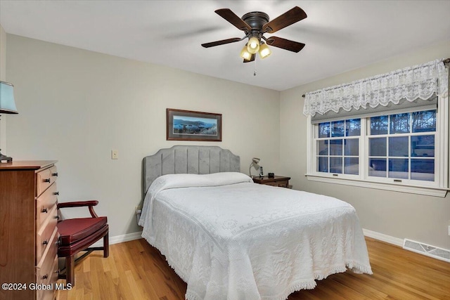 bedroom featuring ceiling fan and light hardwood / wood-style floors