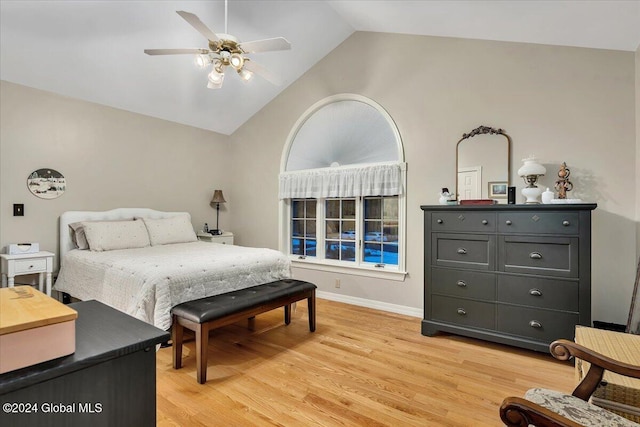 bedroom featuring ceiling fan, high vaulted ceiling, and light wood-type flooring