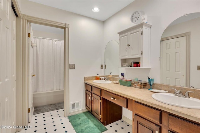 bathroom with vanity and shower / tub combo