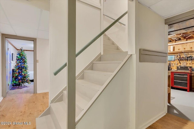 staircase featuring hardwood / wood-style floors