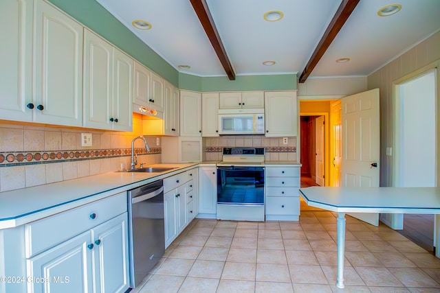 kitchen featuring beam ceiling, white cabinetry, sink, white appliances, and light tile patterned floors