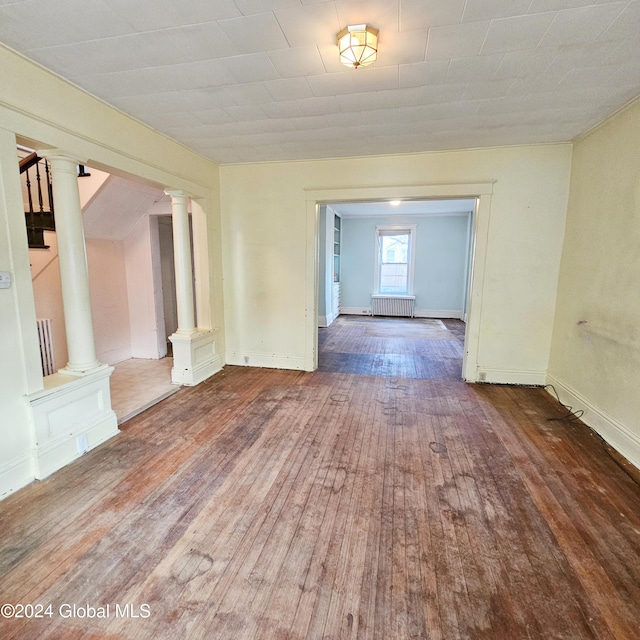 interior space featuring hardwood / wood-style floors and radiator heating unit