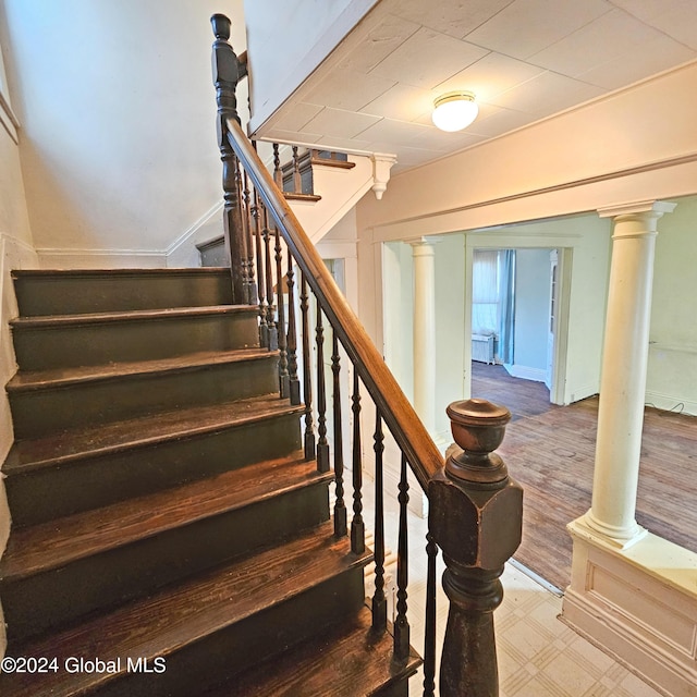 stairway with wood-type flooring