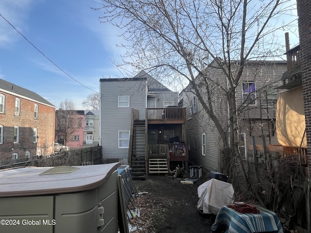 back of property featuring a deck