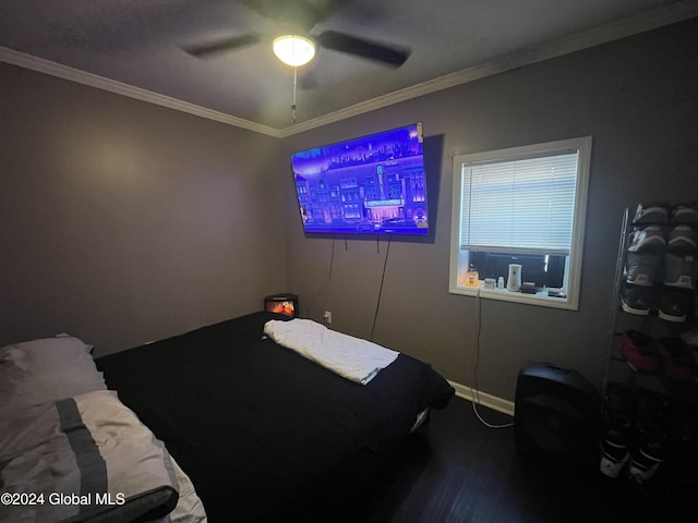 bedroom featuring ceiling fan, crown molding, and hardwood / wood-style floors