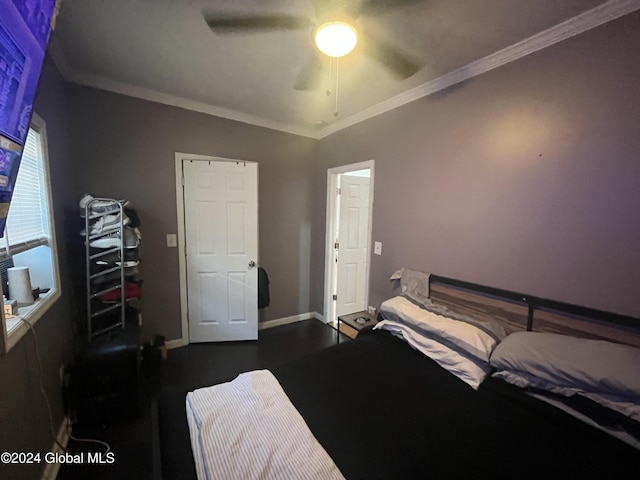 bedroom featuring ceiling fan, dark hardwood / wood-style floors, and ornamental molding