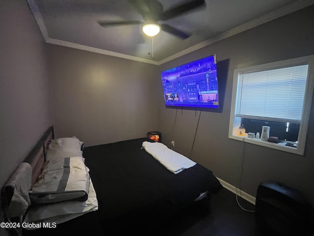 bedroom with ceiling fan and crown molding