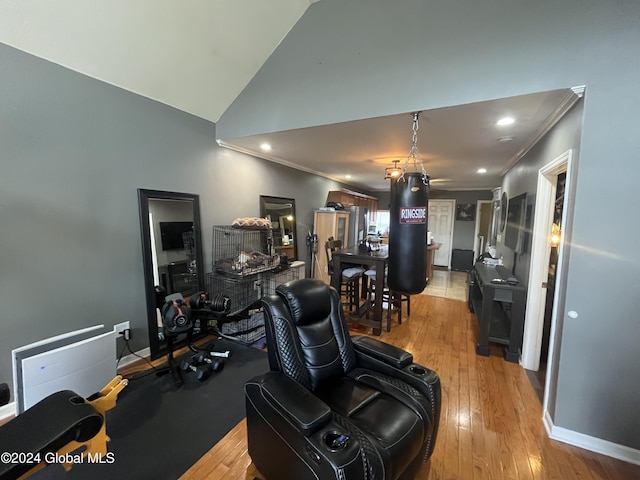 living room with light wood-type flooring and crown molding