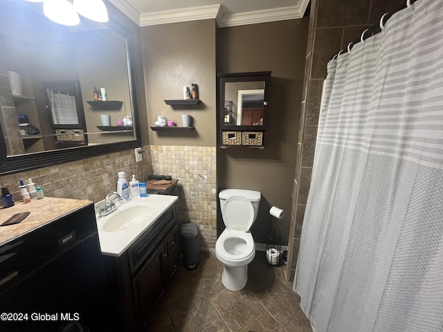 bathroom with tile patterned flooring, vanity, toilet, and ornamental molding