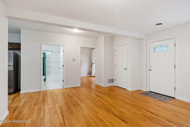 entryway with light hardwood / wood-style flooring