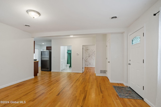 foyer with light hardwood / wood-style flooring