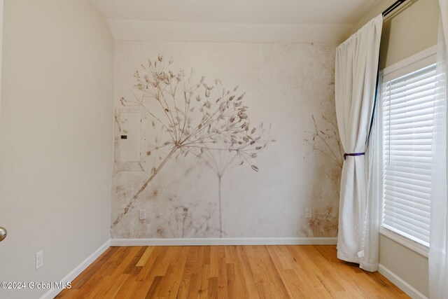 spare room featuring hardwood / wood-style floors