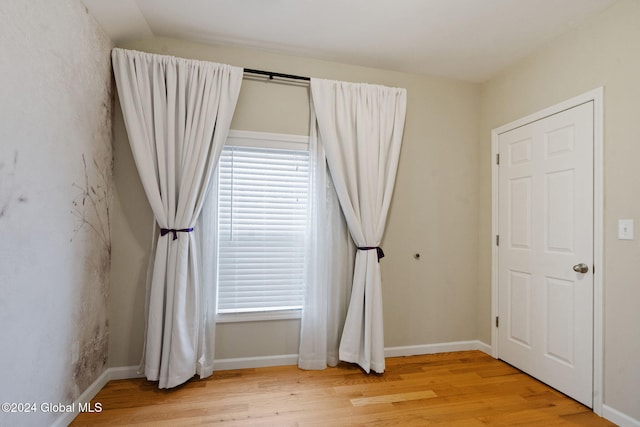 spare room featuring light hardwood / wood-style flooring