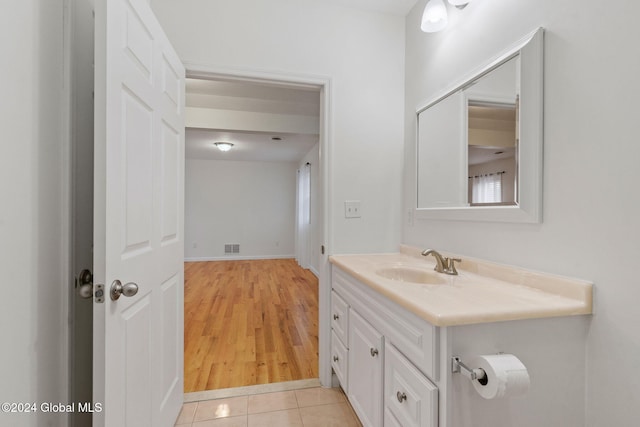 bathroom featuring hardwood / wood-style flooring and vanity