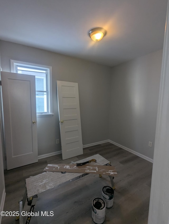 unfurnished room featuring dark hardwood / wood-style floors