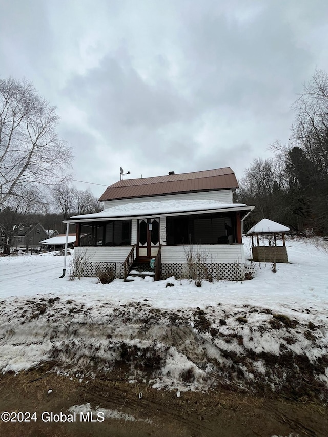 view of snow covered house