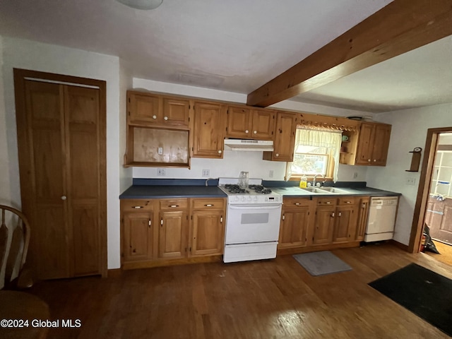 kitchen featuring dark hardwood / wood-style flooring, white appliances, beam ceiling, and sink