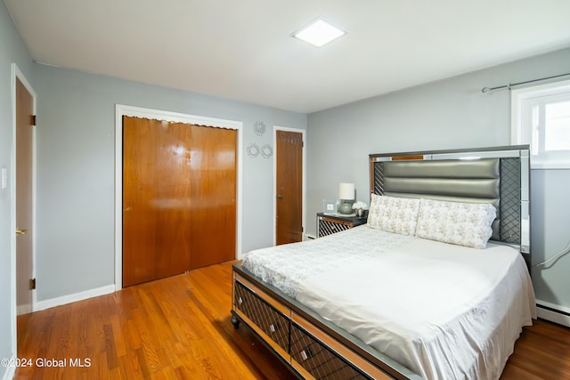 bedroom with hardwood / wood-style flooring