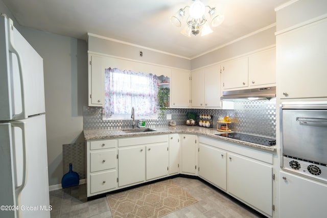 kitchen with sink, backsplash, white fridge, black electric cooktop, and white cabinets