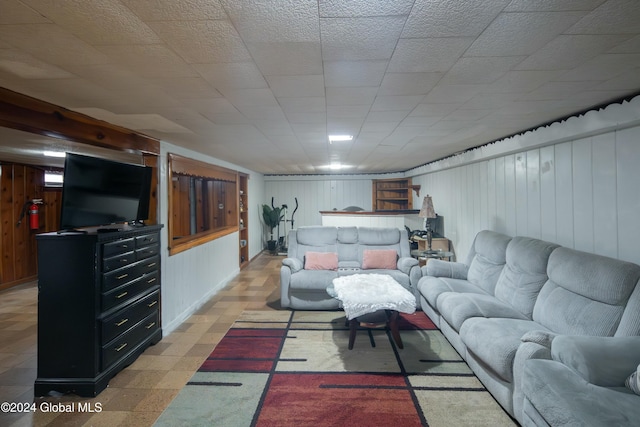 living room with wood walls