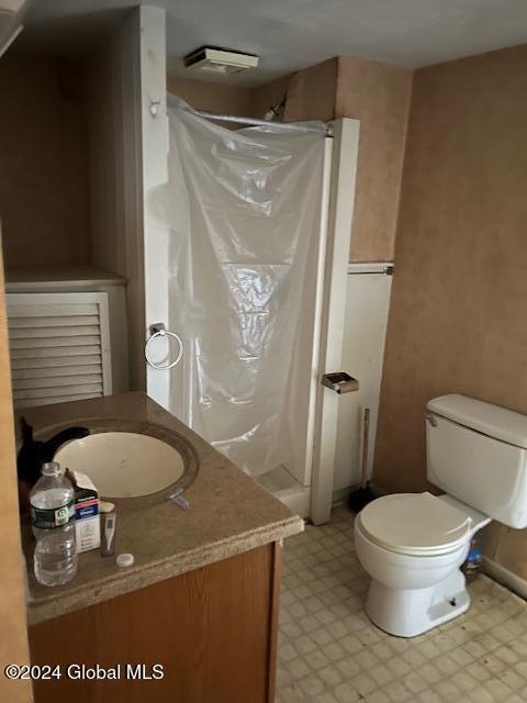 bathroom with vanity and toilet