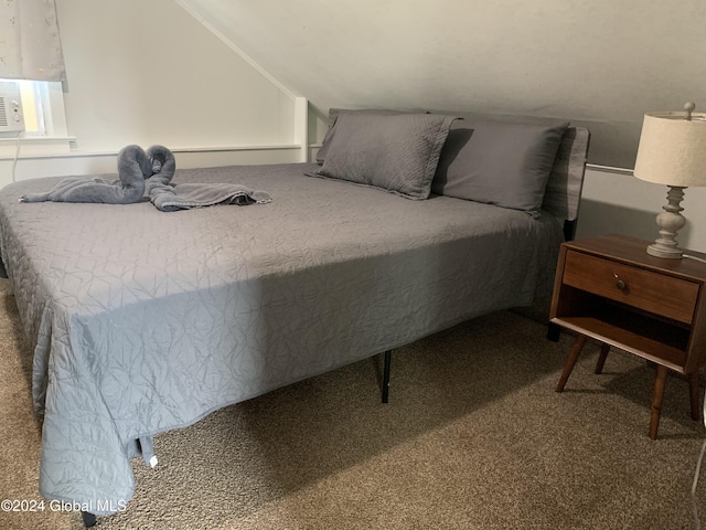 carpeted bedroom featuring vaulted ceiling