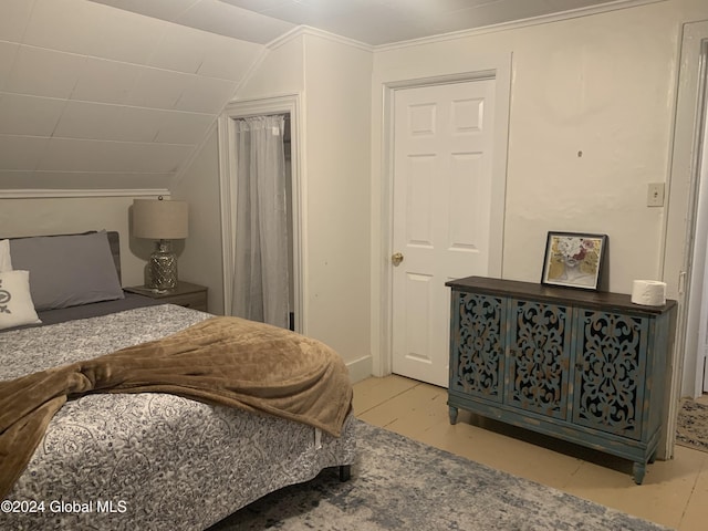 bedroom with lofted ceiling