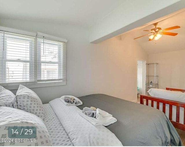 bedroom with lofted ceiling and ceiling fan