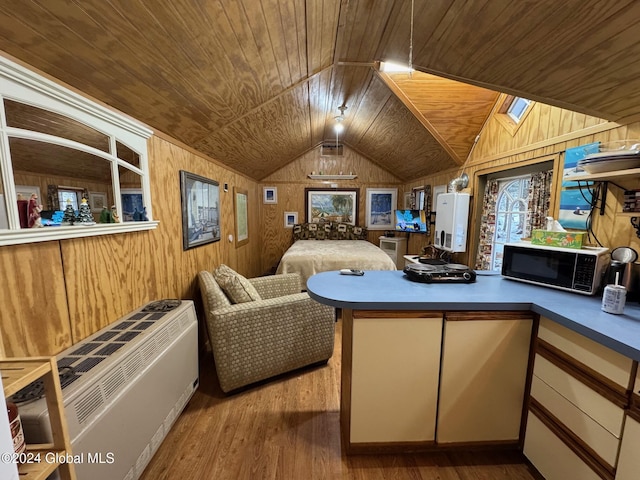 bedroom with light wood-type flooring, wooden ceiling, lofted ceiling with skylight, and wooden walls